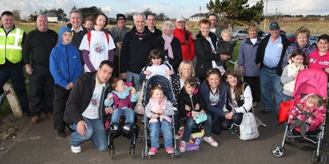 Steve MacDougall, Courier, Easthaven Carpark. Easthaven to Arbroath YOMP. Pictured, those that attended the Easthaven Start. At the front is Carnoustie family Fraser Hirsch, wife Aevril (check spelling) and daughters inlcuding Ayley and Chloe. Also pictured are family and friends of the Hirsch's alongside other walkers.