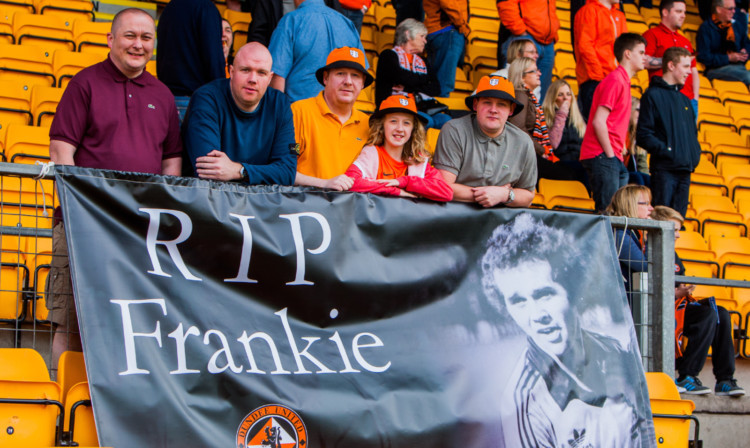 The Frank Kopel Travelling Shindig and Display Boys flew a banner in memory of the Tannadice legend at McDiarmid Park on Saturday. Pictured with the tribute, from left, are Scott Innes, Jimmy McDonald, Jonny Kettles, Emily Kettles and Dane Vannet.