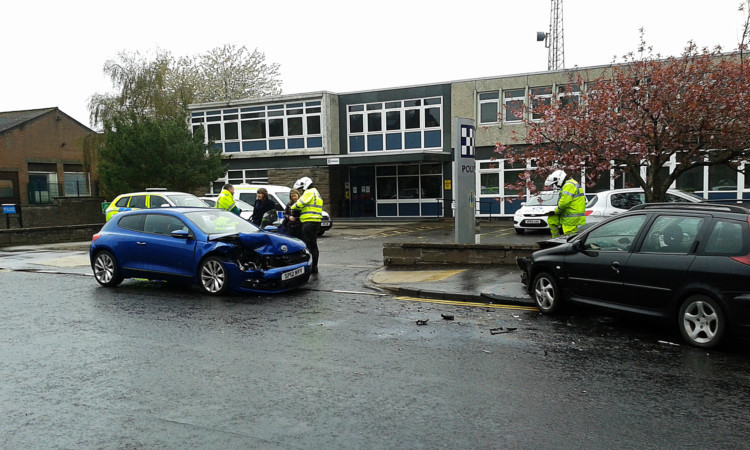 The cars collided outside the Forfar police office on West High Street.