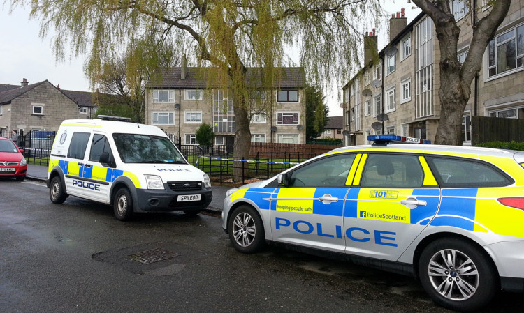 Police have cordoned off the flats in Baldovie Terrace.