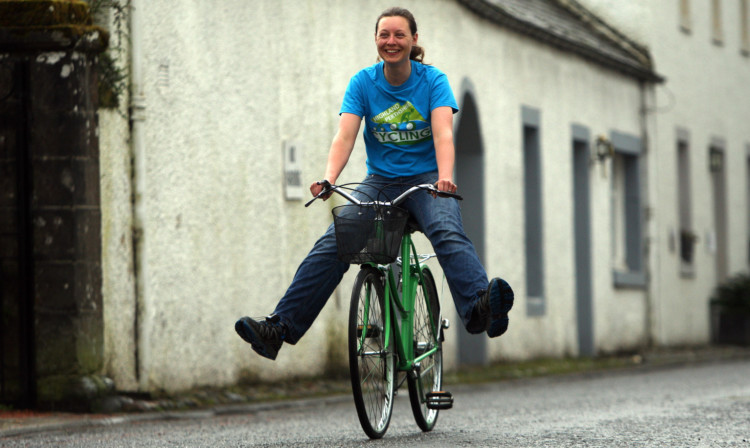 Kat Brown with some of the green bikes.