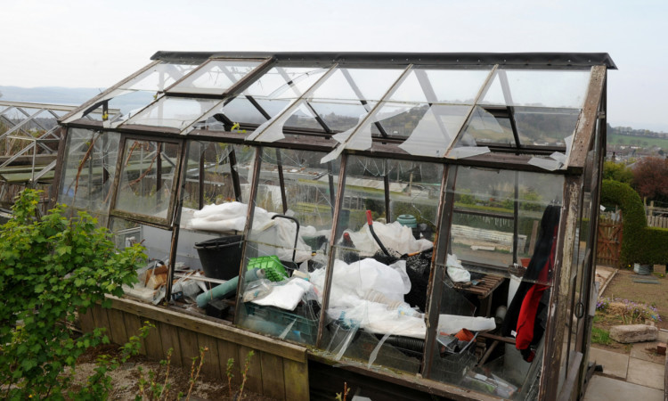A vandalised greenhouse at the allotments.