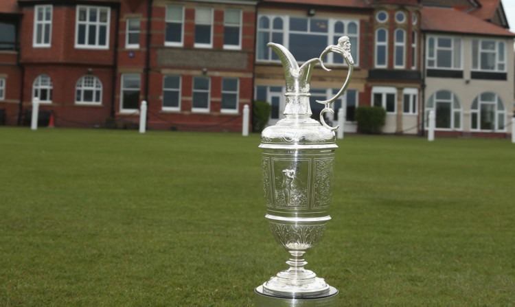 The claret jug, awarded to the winner of the Open, in front of the clubhouse at Hoylake.