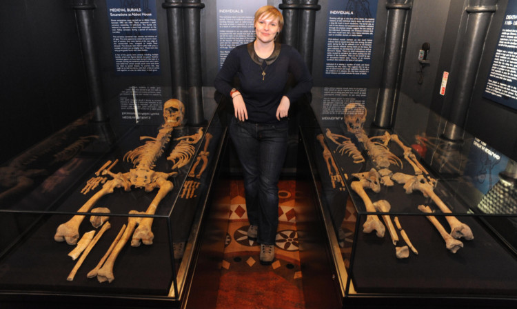 Gillian Ramsay beside the skeletons which form part of the new exhibition.