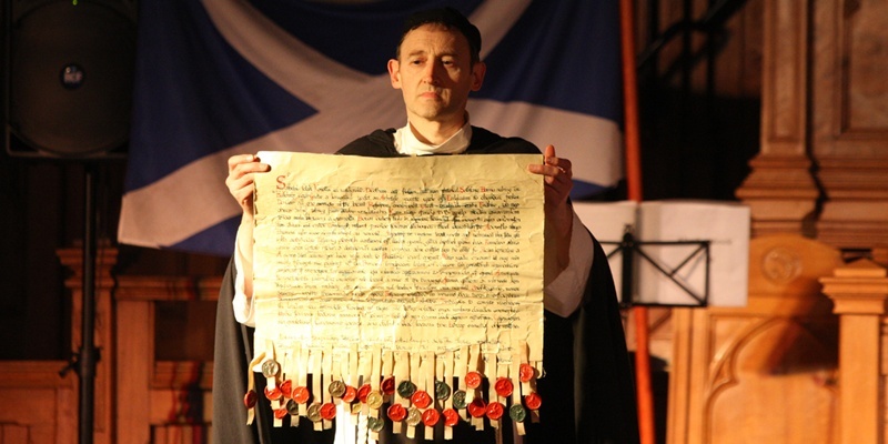 Steve MacDougall, Courier, St Andrews Church, Arbroath. Tartan Day, Signing of the Declaration. Pictured, Ken Lownie (Abbot Pernard) with the Declaration. Check spellings.