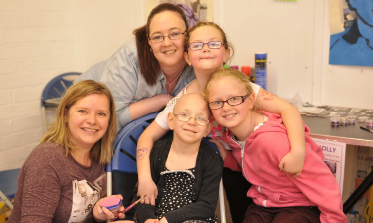 On the face painting stall are back, from left, Elaine Livsey, Vicky Donald (Hollys mum), Hannah Elder and Jennifer Bennett. Seated at the front is Holly.