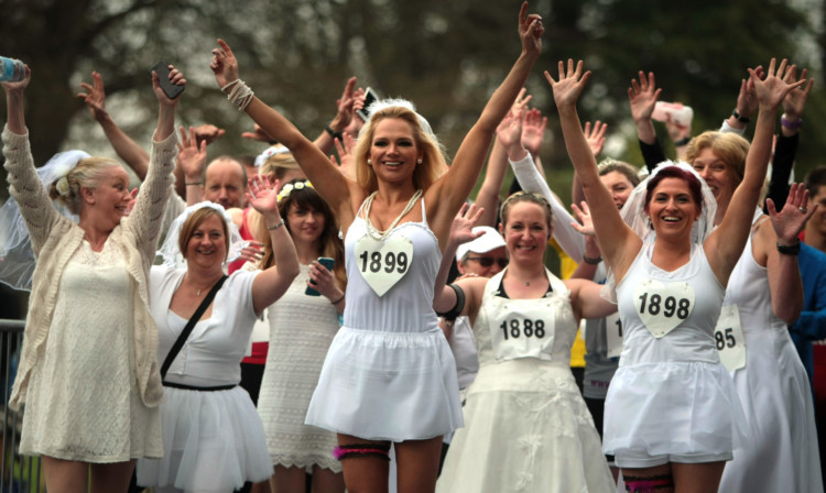 Runners in bridal attire ready to set out on the 10k race.