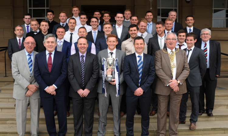 Raith players staff and board members with Gordon Brown, front second left, and Jim Leishman, front right.