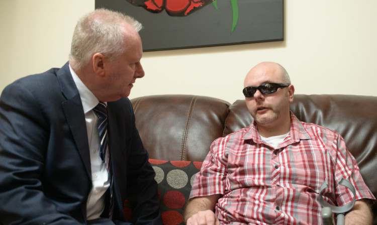 Health secretary Alex Neil visited Keith Swankie, from Arbroath, who suffers from PSP.