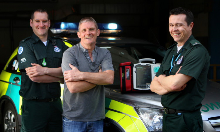 Stuart with Brian Taylor, technician, and Philip Campbell, paramedic.