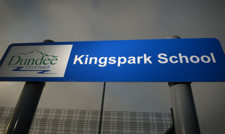 Kim Cessford - 29.04.14 - pictured with 'dramatic' lighting is one of the entrance signs at Kingspark School, Dundee