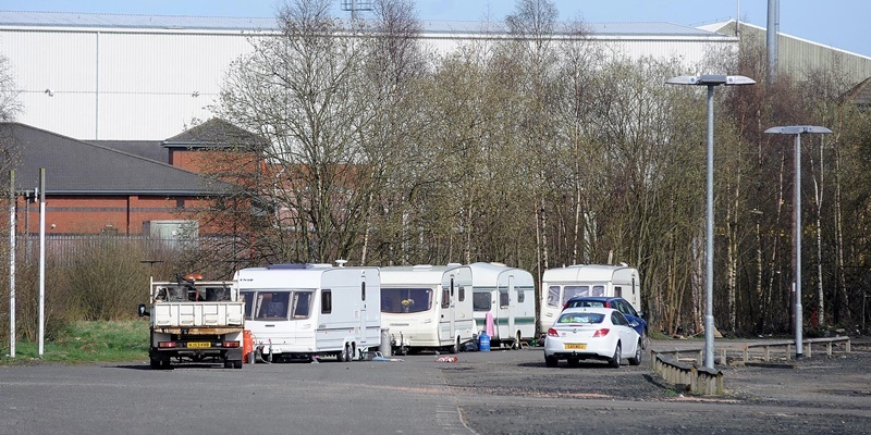 Travellers in the carpark at Lee's Park Road in the shadow of East End Park