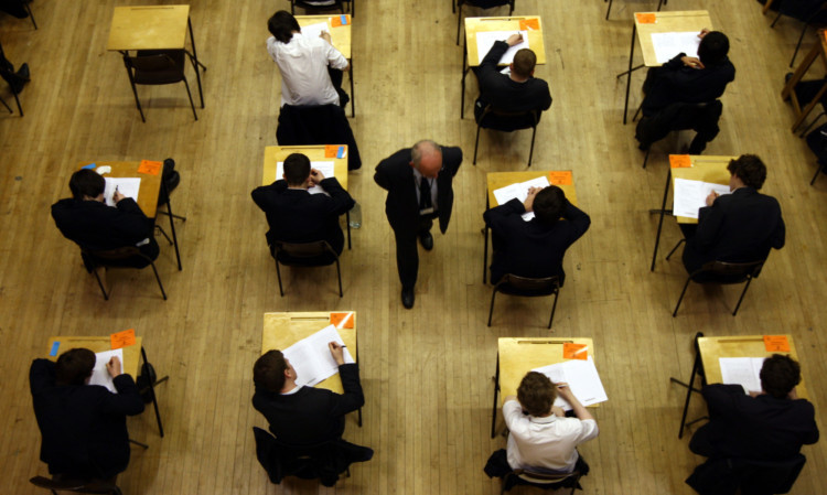 Pupils sit an exam at Lawrence Sheriff school Rugby.  PRESS ASSOCIATION Photo. Wednesday 7th March 2012. Picture credit David Jones/PA