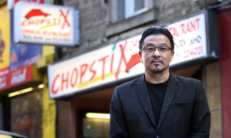 Steve Chow outside his restaurant on St Andrews Street.