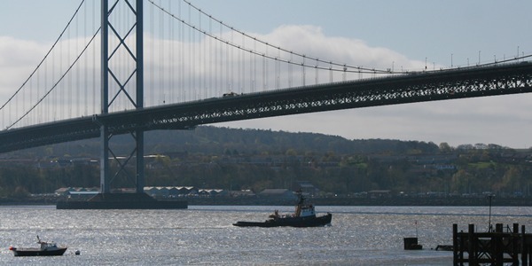 Kris Miller, Courier, 09/04/11. Scenic picture today of tug passing under Forth road bridge.