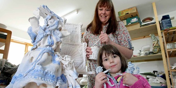 Kim Cessford, Courier - 10.04.11 - pottery artist Marilyn Reid Wood is creating her take on the Bell Rock Lighthouse as part of the Year of the Light celebrations - she is pictured in her studio at Redcastle Pottery, Lunan Bay with her grand daughter Tabitha Wood and some of the elements that will make up the sculpture