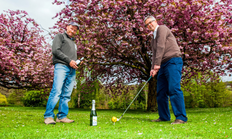 Winery owner Ron Gillies with club managing secretary Mike Brown and the new cider.