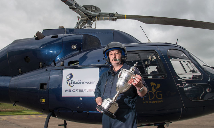 Mike Penman, from PDG Helicopters at Cumbernauld Airport, is ready as Scotland braces itself for Helicopter Saturday which could see the SPFL Championship trophy head to either Dundee, Hamilton or Falkirk.