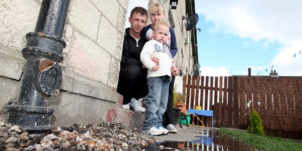 Steve MacDougall, Courier, St Giles Terrace, Dundee. Family home hit by flooding due to blocked sewar. Pictured, James McIntosh with son Harry (aged 5) and daughter Rebecca (aged 11), in front of the pipe.