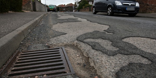 Steve MacDougall, Courier, Watson Drive, Dunfermline. Pictures of pot holes!