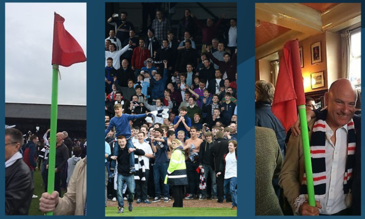 The flag (seen on the right with Patrick Barclay) was taken during the Dens Park pitch invasion.