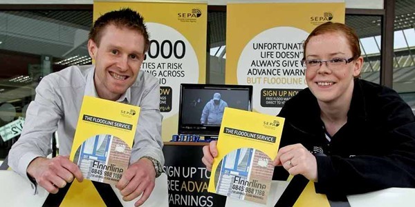 Kim Cessford, Courier - 14.04.11 - the SEPA Floodline roadshow arrived in the Abbeygate Centre, Arbroath to raise awareness of the early warning system that the public can sign up for - pictured are l to r - SEPA Roadshow Advisor Neil Richardson and SEPA Communications Officer Emma Niedzwiedz