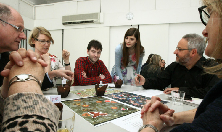 Artist In Residence at the V&A Sophia George (standing) with some of the participants of Ignite Dundee.