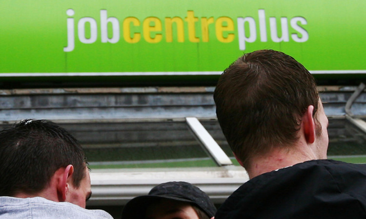 A group of men wait outside Chatham Job Centre Plus in Kent. Picture date: Thursday 19th March 2009. See PA story credit should read: Gareth Fuller/PA Wire ... Unemployment figures ... 19-03-2009 ... Chatham ... UK ... Photo credit should read: Gareth Fuller/PA Archive. Unique Reference No. 7023143 ...