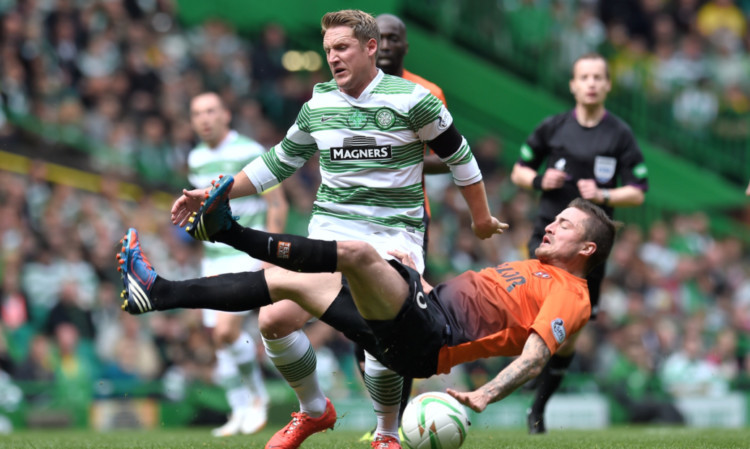 Kris Commons (left) battles with Paul Paton.