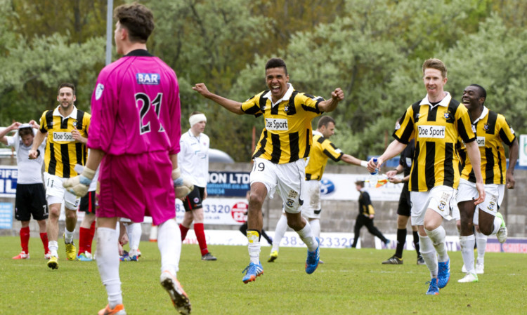 East Fife players rush to congratulate Dylan Rooney after his shoot-out heroics.