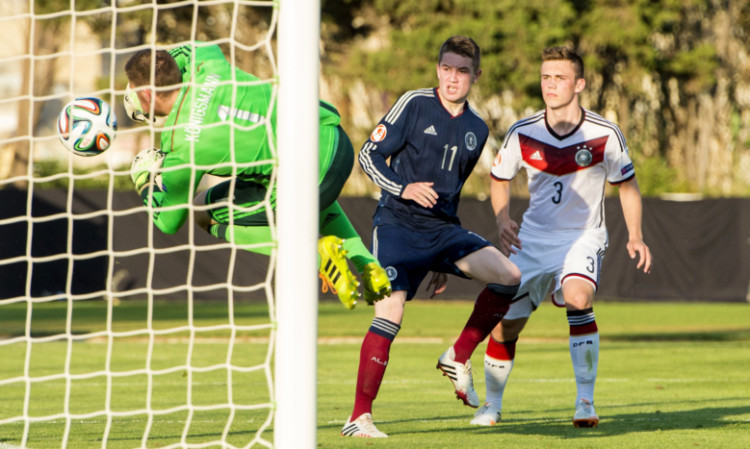 Scott Wright looks on as Germany keeper Timo Konigsmann fumbles his effort into the net.