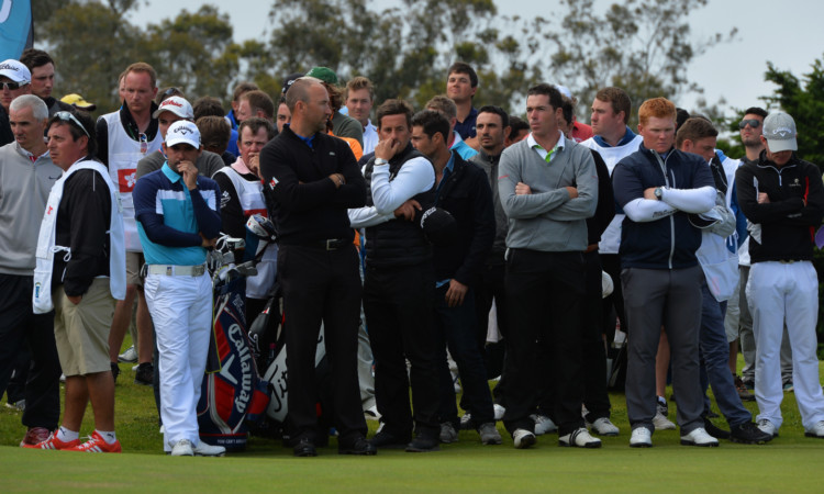 Competitors observe a minute's silence in memory of Mac at Madeira on Sunday.