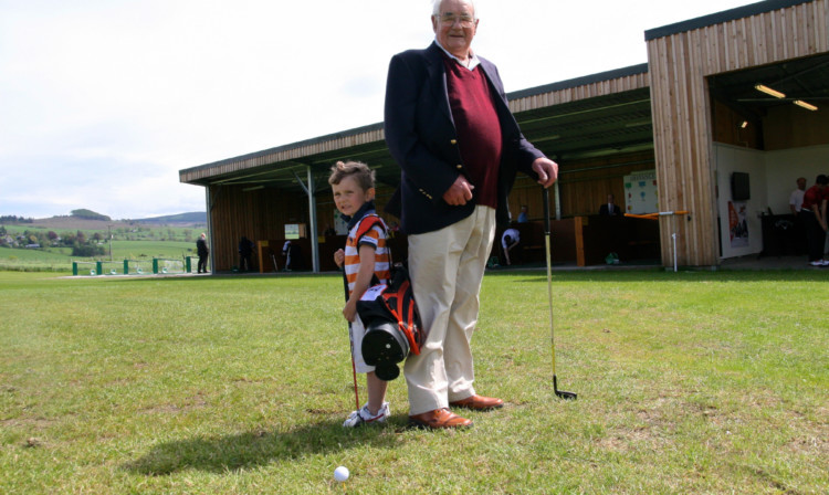 Neil Panton, 94, and Daniel Kearney, 3, are equally delighted by the opening of the new golf academy.
