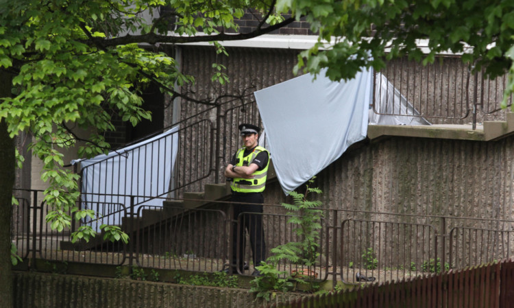 A police presence at the scene of the tragedy.