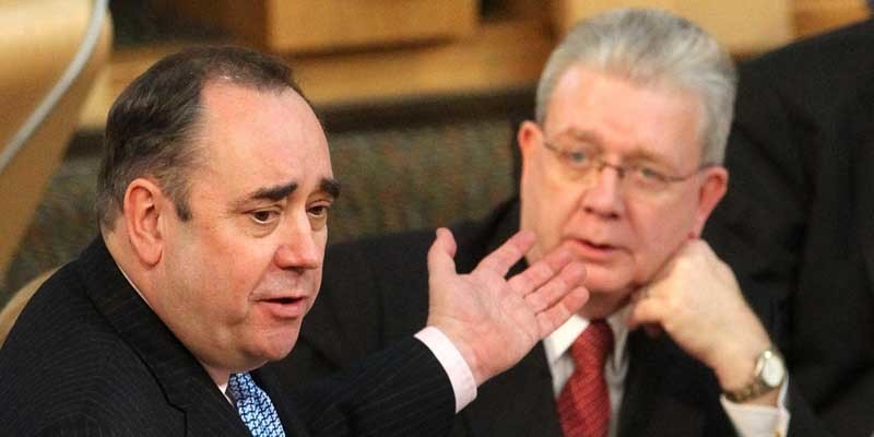 Scotland's First Minister Alex Salmond (left) and Education Secretary Mike Russell during First Minister Questions at the Scottish Parliament in Edinburgh.