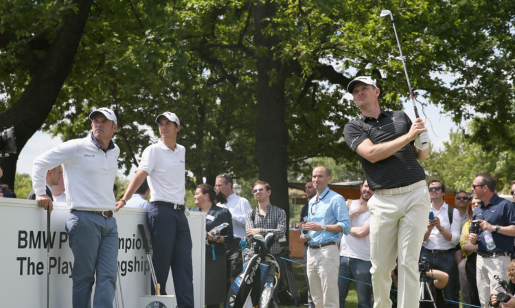 Justin Rose tees-off in the contest in Hyde Park, London, with Paul McGinley and Matteo Manassero.