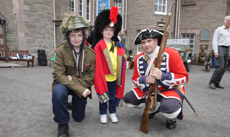 Brendan Mitchell and Abby Reid with re-enactor Mike Newcomen.