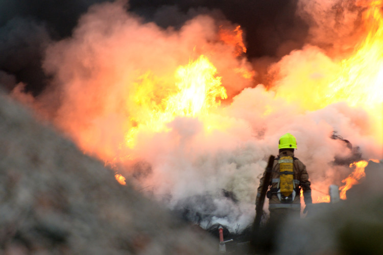 Firefighters battled a large blaze between Douglas and Whitfield on May 19 after tyres were set alight. Emergency services rushed to Piper Street, near Whitfield, and appliances from the Kingsway fire station used water jets for over two hours before the inferno was contained.