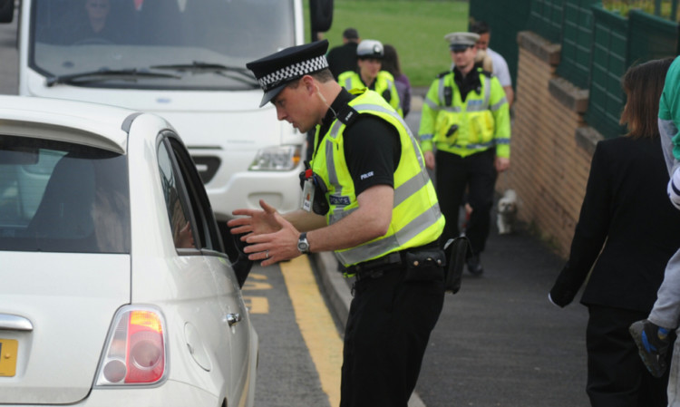 Police chat with drivers at Birkhill Primary School.