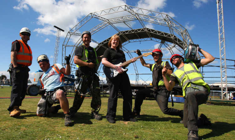 Nick Toy, Jack Lea, Nathan Cox, Gillian Donaldson, Anthony Gillingham and Bradley Walden, the crew building the stage for the Status Quo concert tomorrow night, take time out to get some practice.