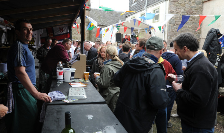 People enjoying the 2013 Ron Bonnar Beer Festival at the Fisherman's Arms.