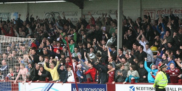 DOUGIE NICOLSON, COURIER, 23/04/11,SPORT.
DATE - Saturday 23rd April 2011.
LOCATION - Gayfield, Arbroath.
EVENT - Arbroath V Montrose.
INFO - Arbroath fans celebrate the fourth goal, and begin to savour winning the title.
STORY BY - Forfar office.