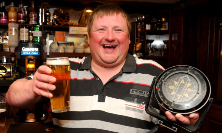 David Irvine enjoys a pint in the Harbour Bar in Gourdon.