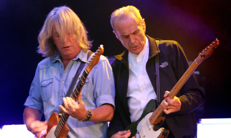 Rick Parfitt and Francis Rossi and Rick Parfitt blast out the hits.