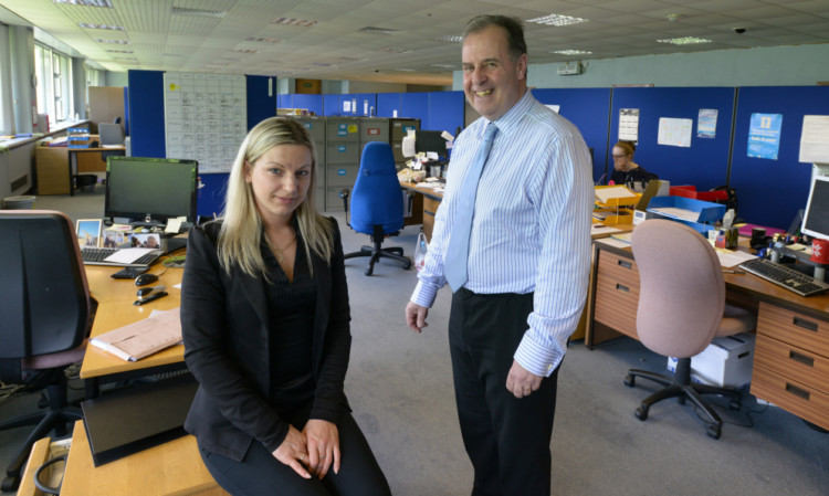 Julja Puskina and Derek Sharkey, of Positive Steps, in the building which has now been reoccupied by charity organisations.