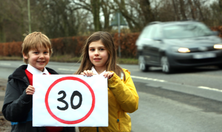 Pupils Fraser Gray and Emily Garness were among those campaigning for the speed limit to be reduced.