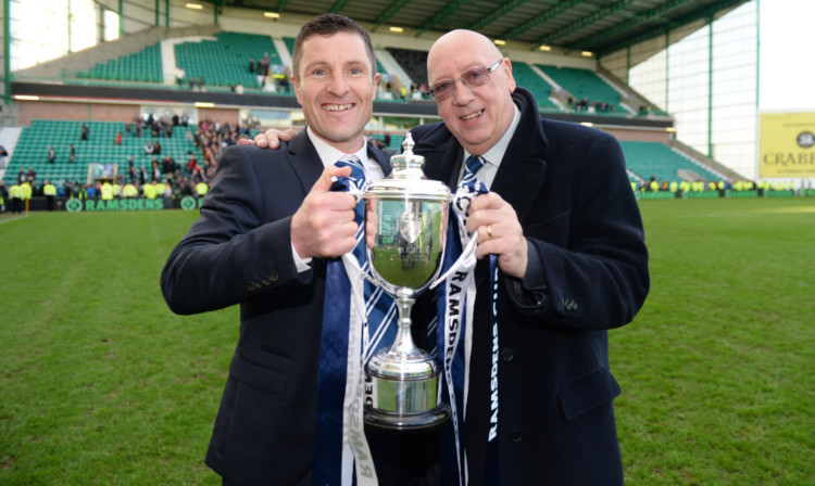 Turnbull Hutton celebrates Ramsdens Cup success with boss Grant Murray.