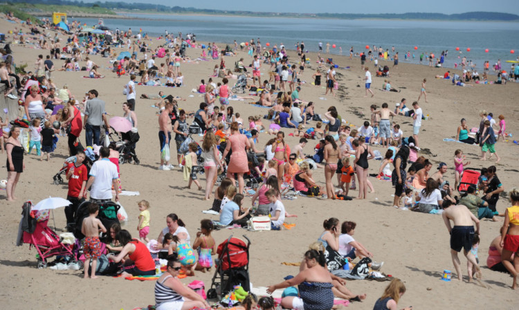 Crowds enjoying a sunny day at Broughty Ferry beach.