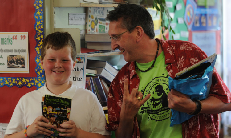 At Northmuir PS are author Stuart Reid and pupil Connor McAuley, also below, who received books.