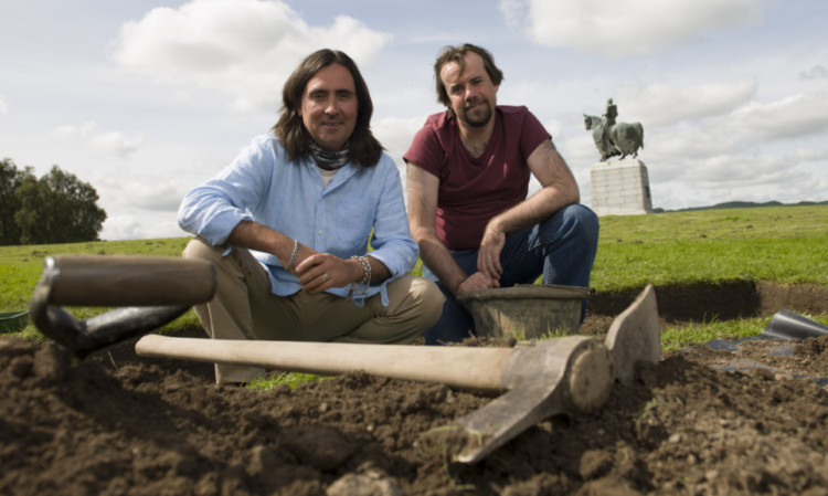 Neil Oliver and Tony Pollard at the statue of Robert the Bruce at Bannockburn.